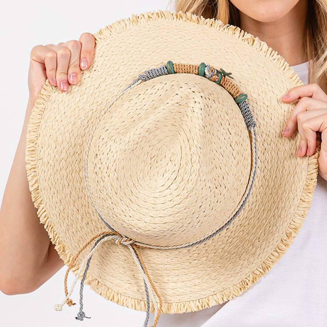 Frayed straw hat with braided starfish