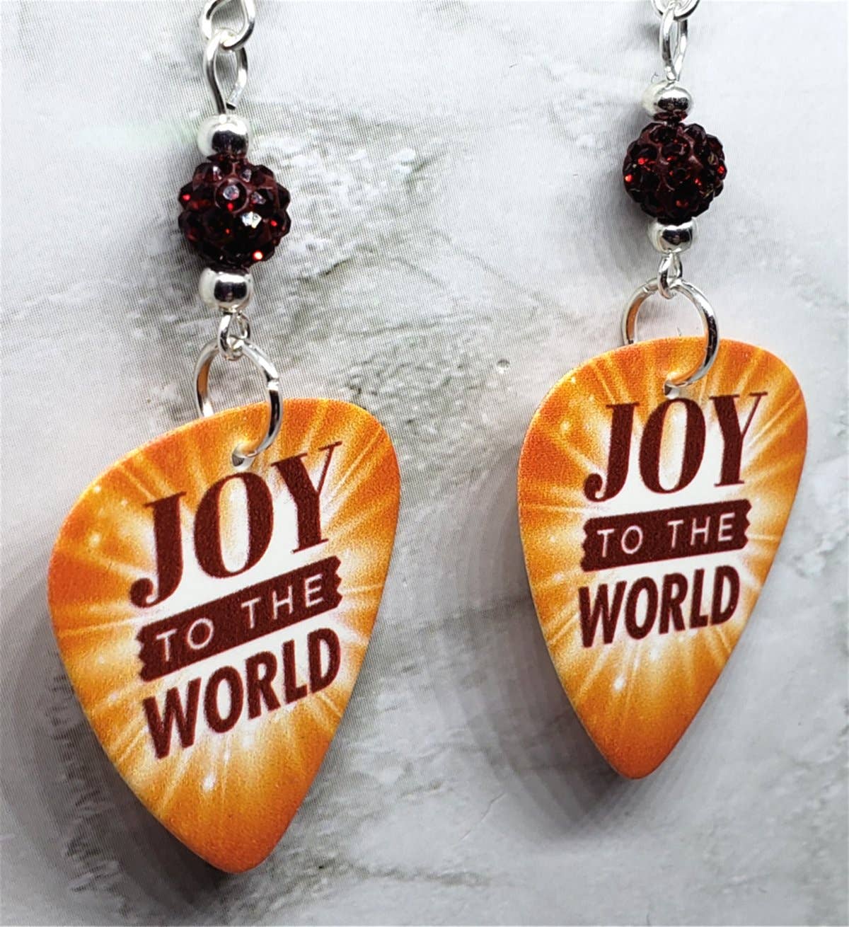 Joy To The World Guitar Pick with Deep Red Pave Beads