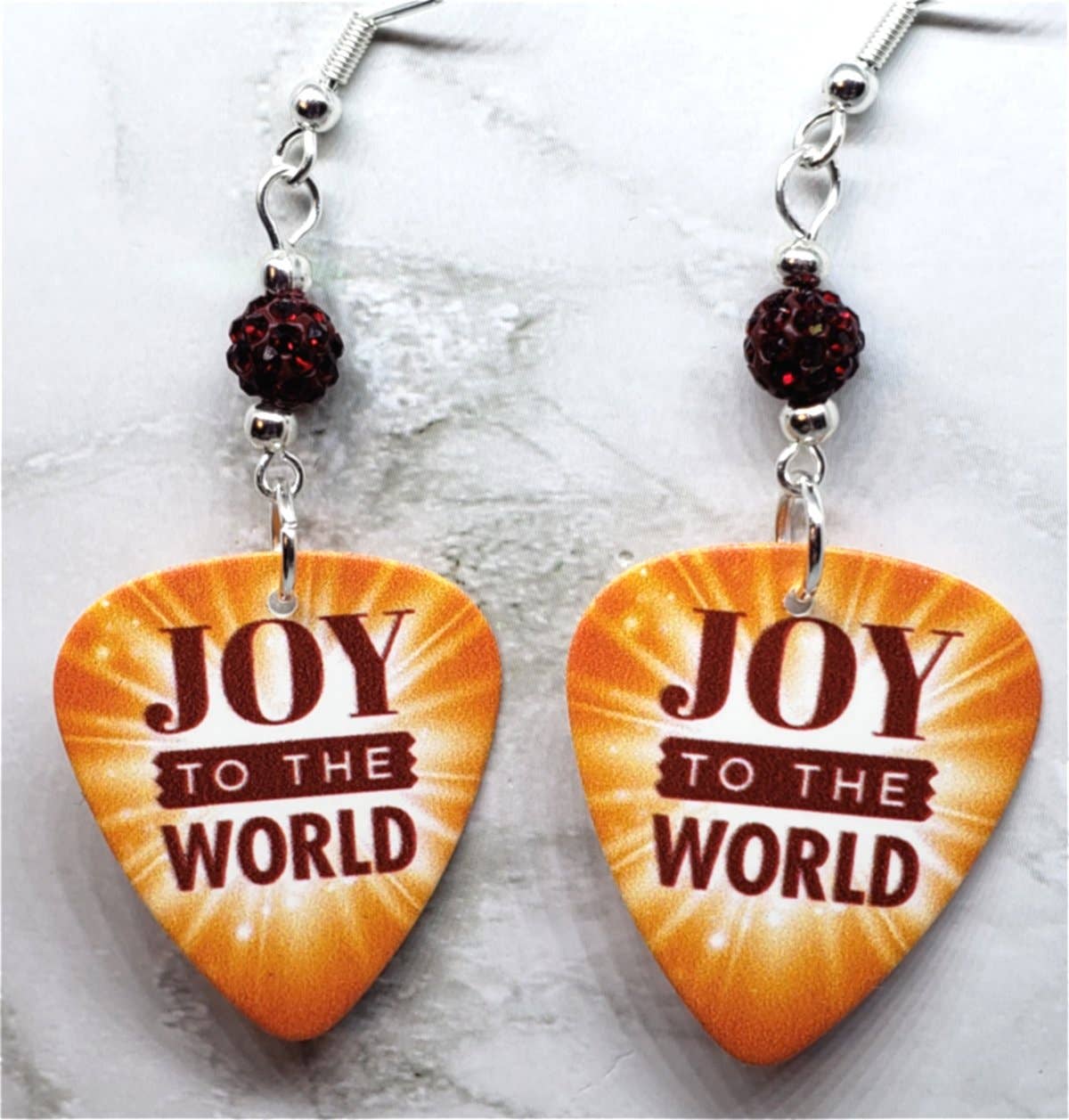 Joy To The World Guitar Pick with Deep Red Pave Beads